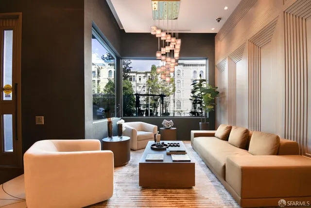 a living room with furniture and a large window