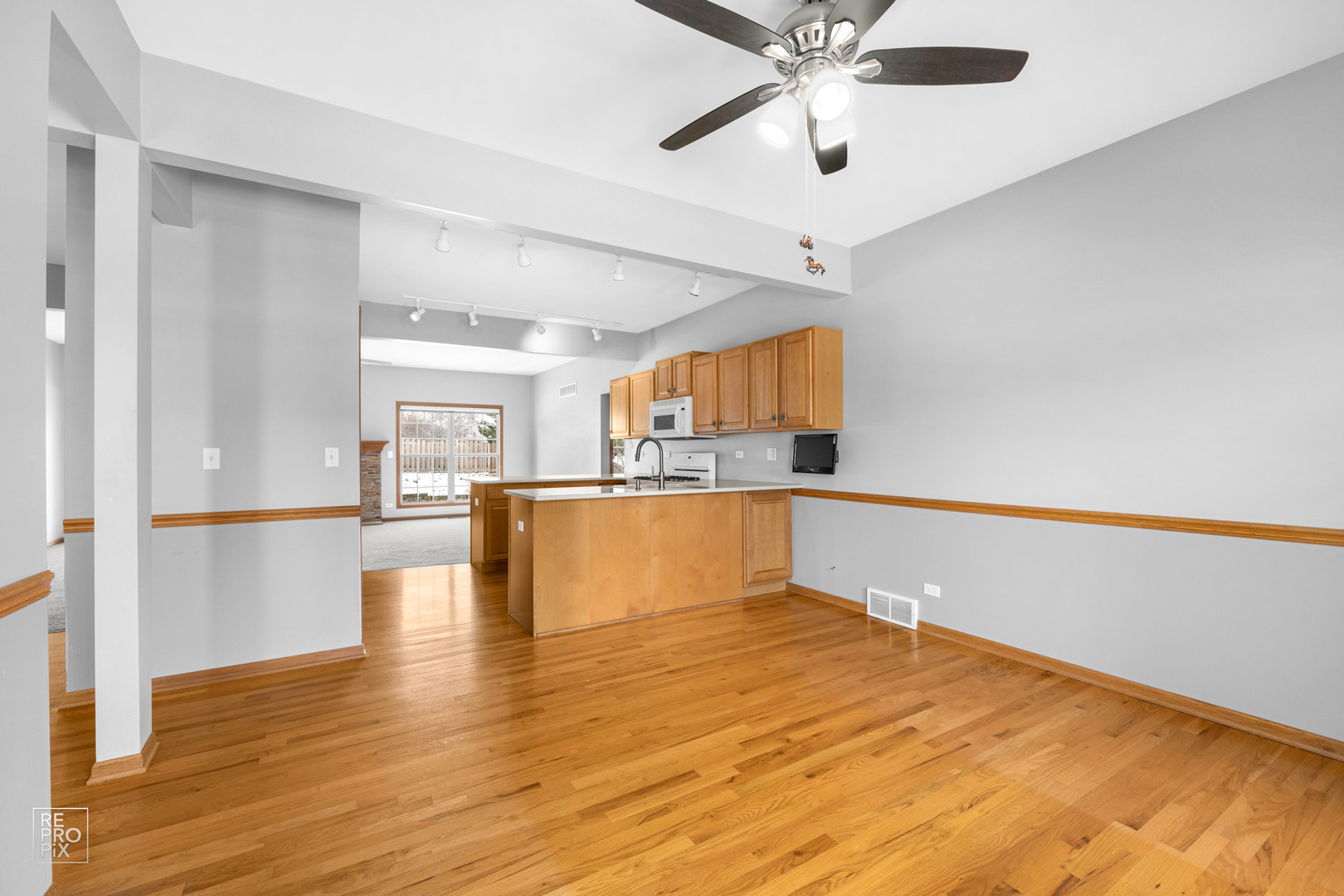 722 Ridge Drive Elburn, IL 60119 - Photo 3 of 23 a view of kitchen and hall with wooden floor