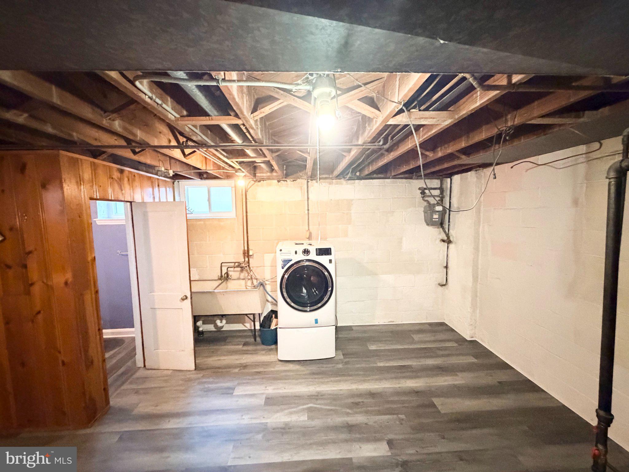 1615 Burnwood Road Baltimore, MD 21239 - Photo 74 of 83 Spacious basement with laundry setup.