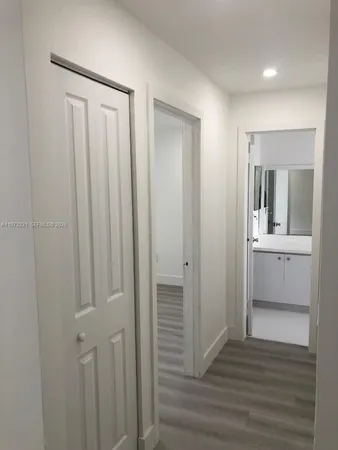 a view of room with window and hardwood floor