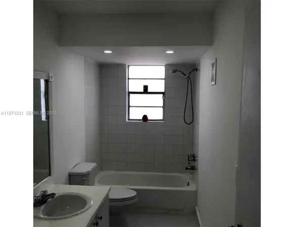a view of a bathroom from the hallway