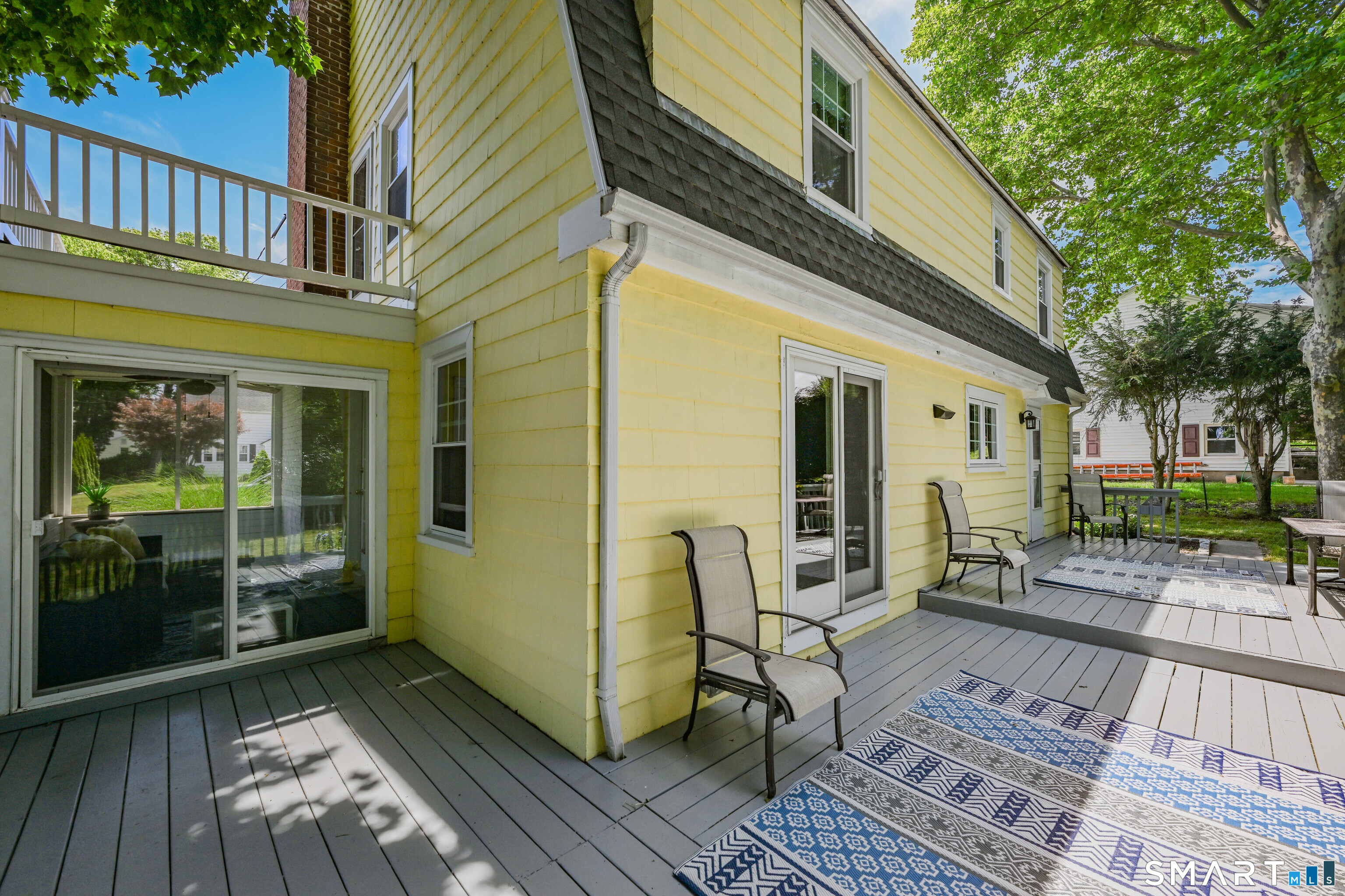 219 Clearfield Road Wethersfield, CT 06109 - Photo 14 of 37 access to sunporch and kitchen from deck