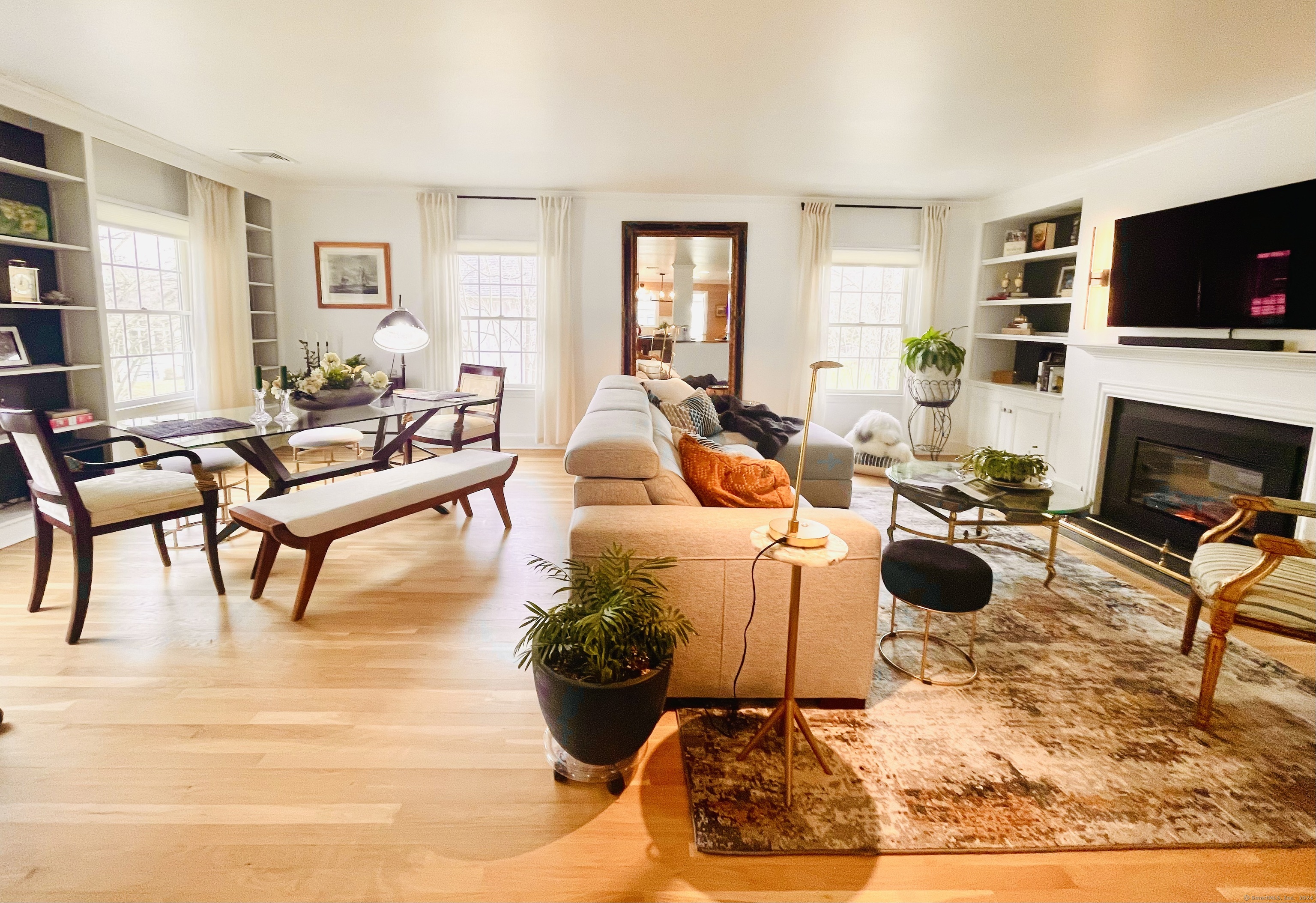 14 Ferry Road, Unit A2 Old Lyme, CT 06371 - Photo 1 of 1 a living room with furniture a flat screen tv and a fireplace