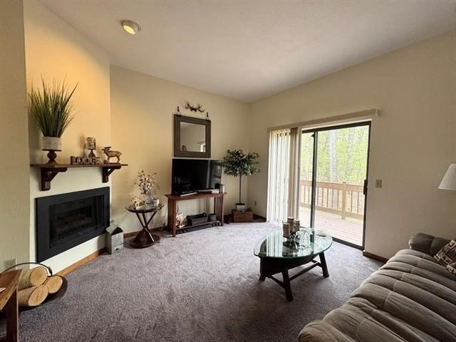 43 West Meadow Road, Unit 43 Haverhill, MA 01832 - Photo 9 of 42 a living room with furniture gym equipment and a fireplace