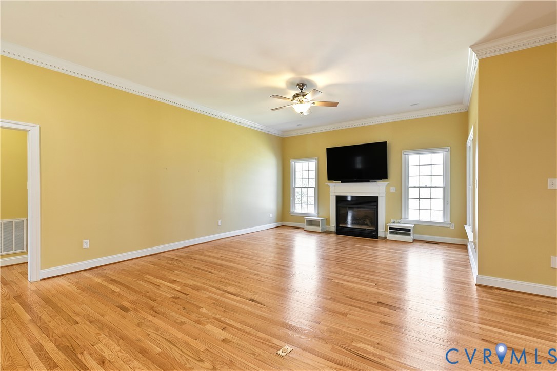 630 Cross Ridge Lane Manakin-Sabot, VA 23103 - Photo 11 of 48 a view of a livingroom with wooden floor and a flat screen tv