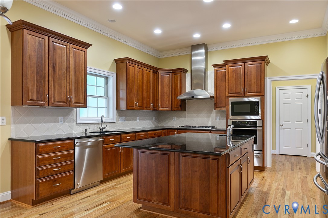 630 Cross Ridge Lane Manakin-Sabot, VA 23103 - Photo 12 of 48 a kitchen with stainless steel appliances granite countertop wooden cabinets a stove top oven a sink and dishwasher