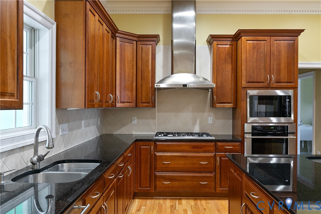 630 Cross Ridge Lane Manakin-Sabot, VA 23103 - Photo 13 of 48 a kitchen with granite countertop a sink and stainless steel appliances