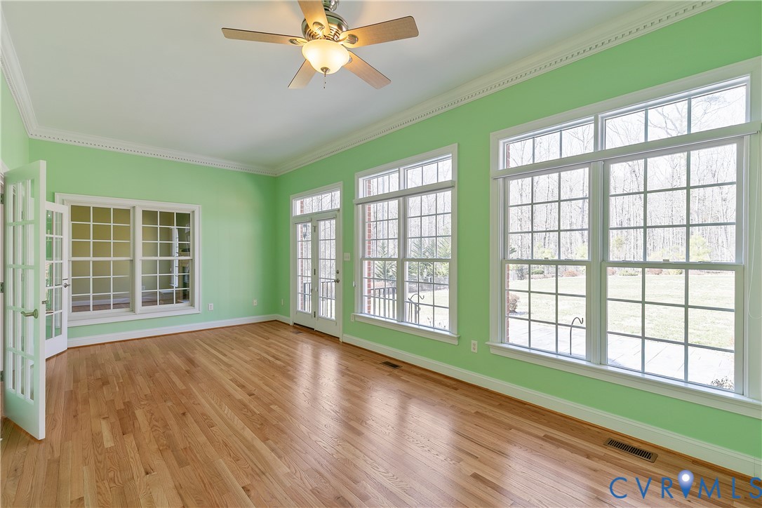 630 Cross Ridge Lane Manakin-Sabot, VA 23103 - Photo 18 of 48 a view of an empty room with wooden floor and a window