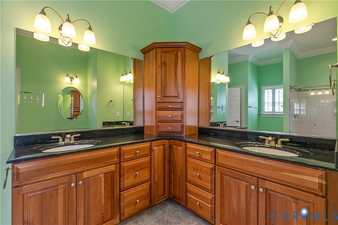 630 Cross Ridge Lane Manakin-Sabot, VA 23103 - Photo 24 of 48 a bathroom with a double vanity sink and a mirror