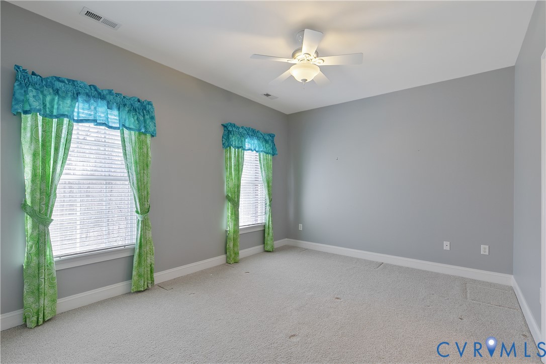630 Cross Ridge Lane Manakin-Sabot, VA 23103 - Photo 30 of 48 an empty room with windows and entrance