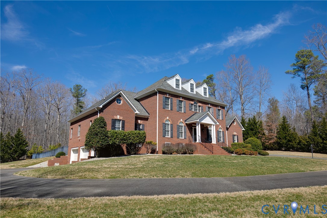 630 Cross Ridge Lane Manakin-Sabot, VA 23103 - Photo 3 of 48 a front view of a house with a yard