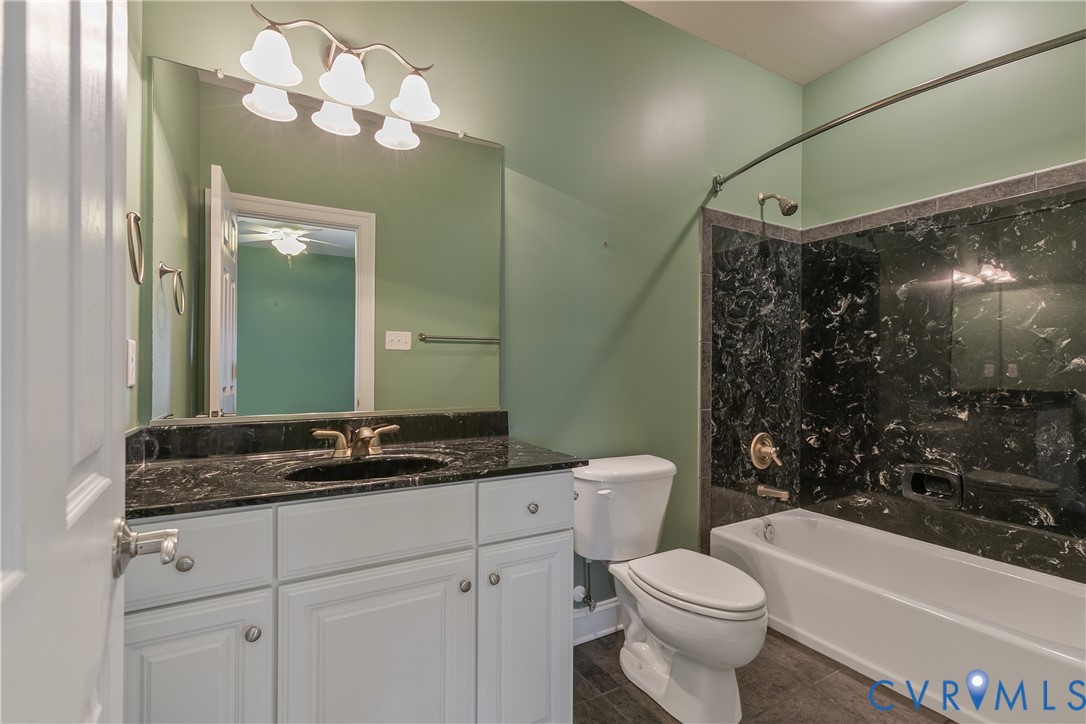 630 Cross Ridge Lane Manakin-Sabot, VA 23103 - Photo 33 of 48 a bathroom with a sink a toilet and shower