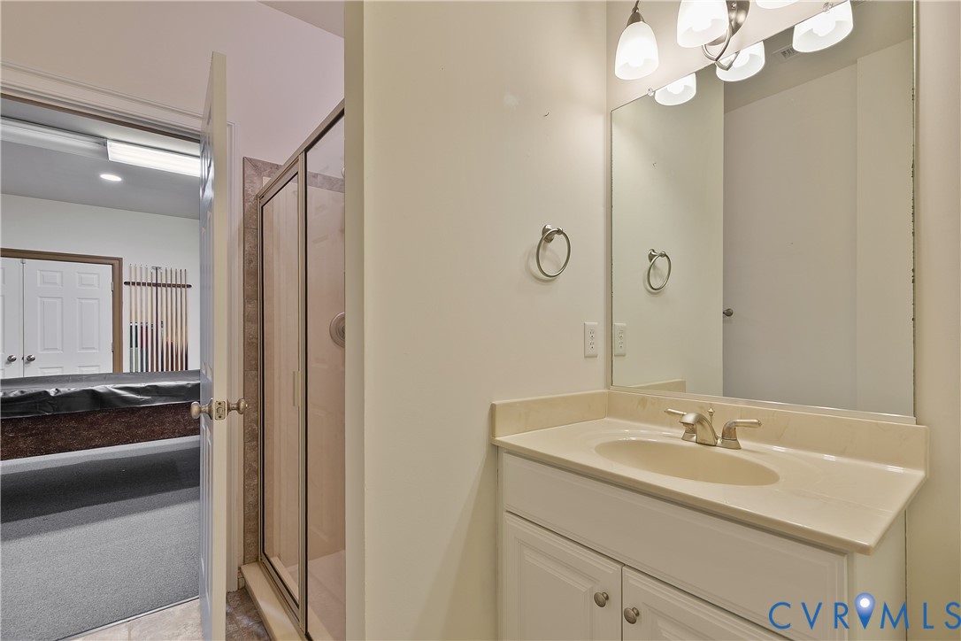 630 Cross Ridge Lane Manakin-Sabot, VA 23103 - Photo 41 of 48 a bathroom with a sink and a mirror