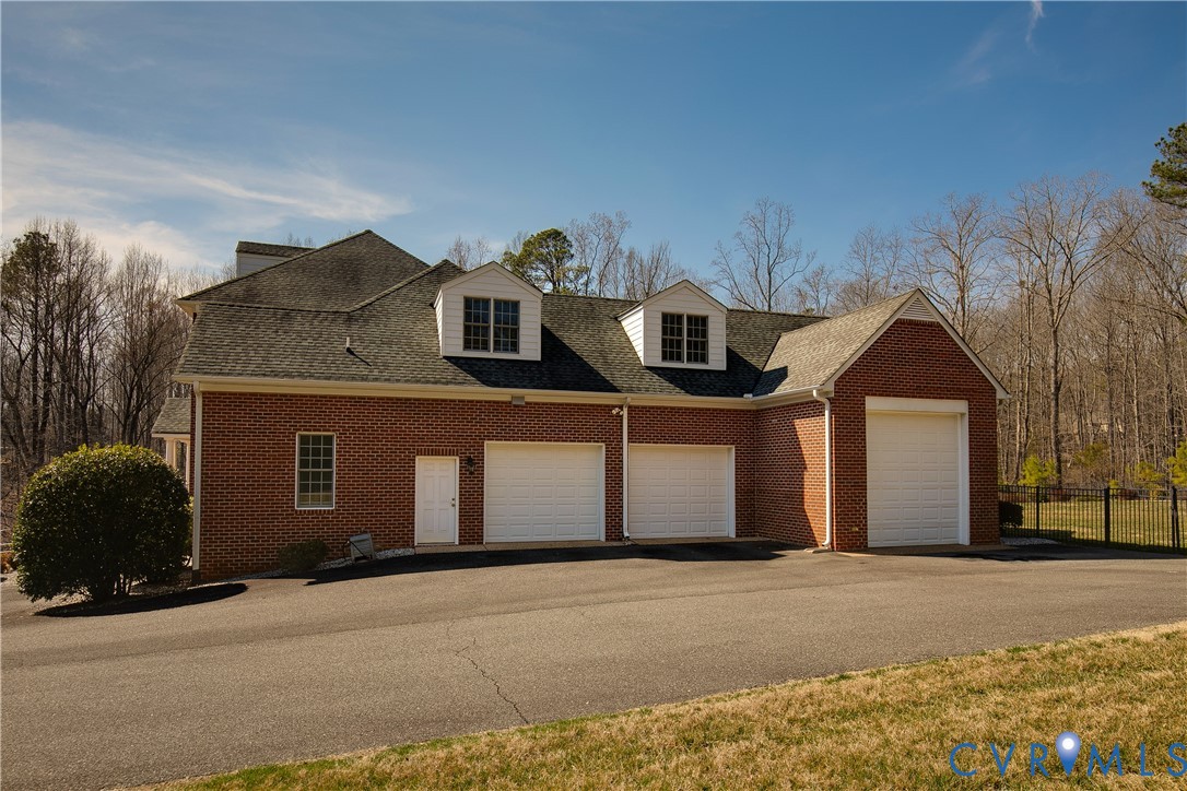 630 Cross Ridge Lane Manakin-Sabot, VA 23103 - Photo 44 of 48 a front view of a house with a yard and garage