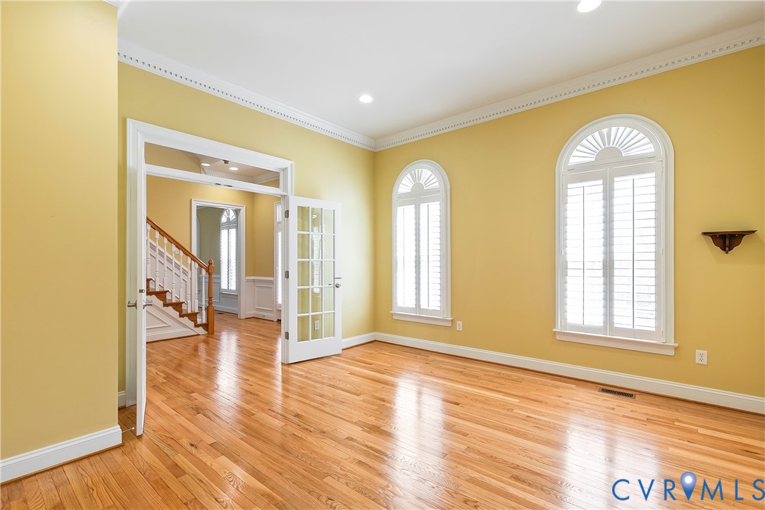 630 Cross Ridge Lane Manakin-Sabot, VA 23103 - Photo 9 of 48 a view of empty room with wooden floor and fan