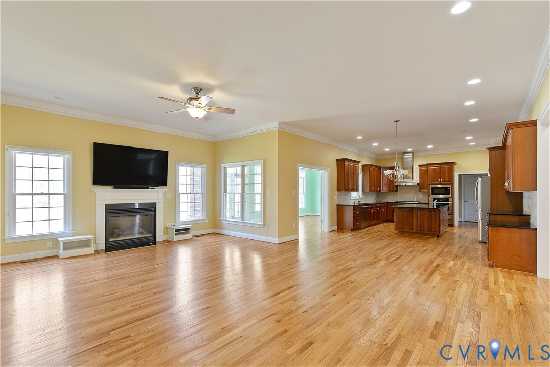 630 Cross Ridge Lane Manakin-Sabot, VA 23103 - Photo 10 of 48 a view of a living room a flat screen tv and a fireplace