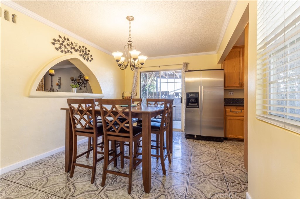 9021 Oneida Avenue Sun Valley, CA 91352 - Photo 11 of 36 a view of a dining room with furniture and chandelier