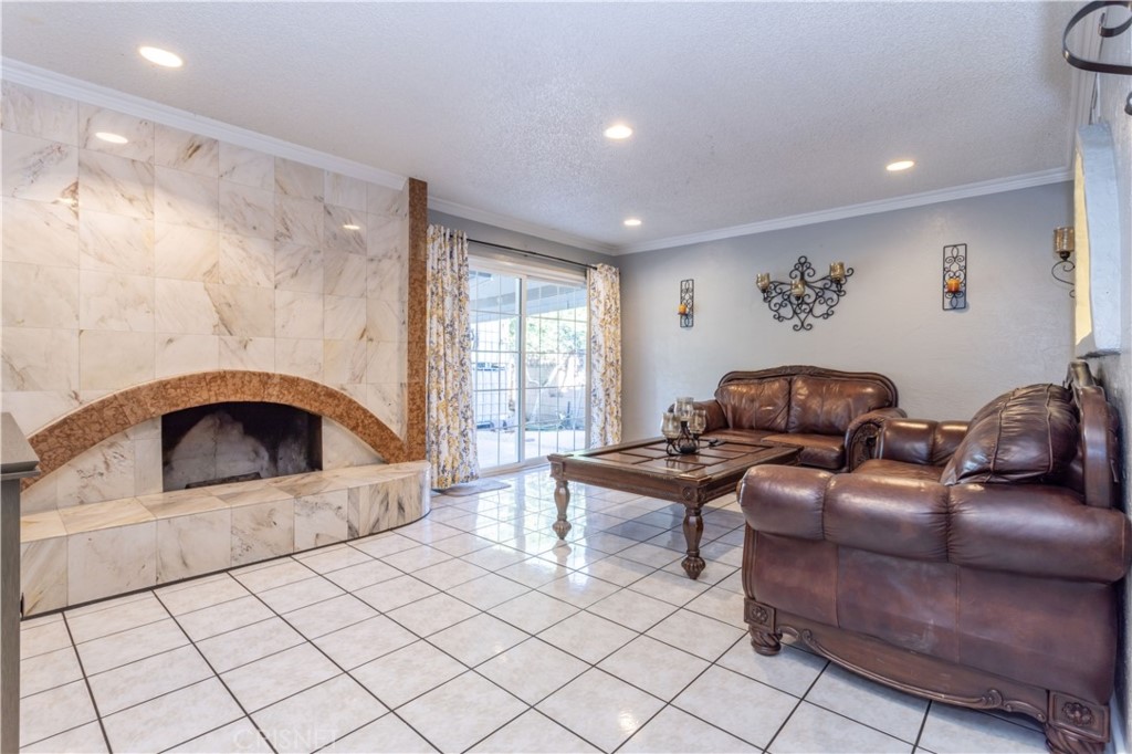 9021 Oneida Avenue Sun Valley, CA 91352 - Photo 14 of 36 a living room with furniture and a fireplace