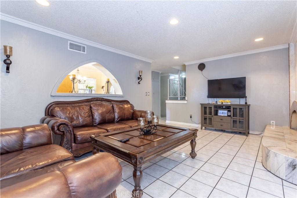 9021 Oneida Avenue Sun Valley, CA 91352 - Photo 15 of 36 a living room with furniture and a flat screen tv