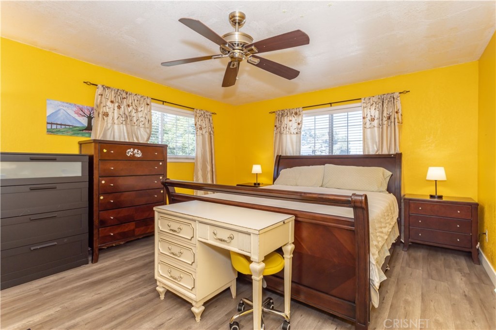 9021 Oneida Avenue Sun Valley, CA 91352 - Photo 19 of 36 a bedroom with a bed and wooden furniture