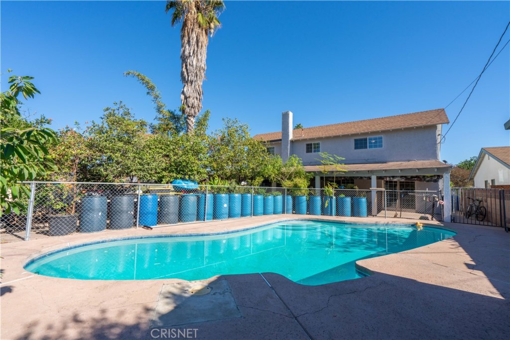 9021 Oneida Avenue Sun Valley, CA 91352 - Photo 35 of 36 a view of a house with a yard and potted plants