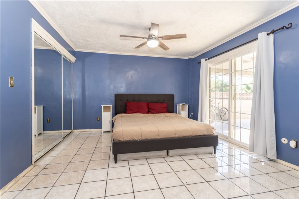 9021 Oneida Avenue Sun Valley, CA 91352 - Photo 5 of 36 a bedroom with a bed and window