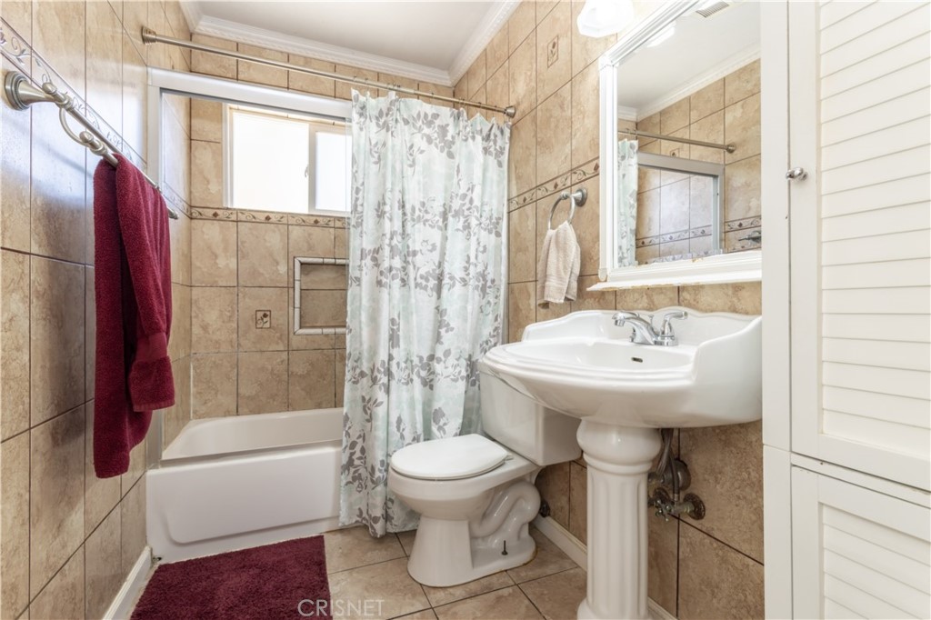 9021 Oneida Avenue Sun Valley, CA 91352 - Photo 9 of 36 a bathroom with a sink toilet and shower
