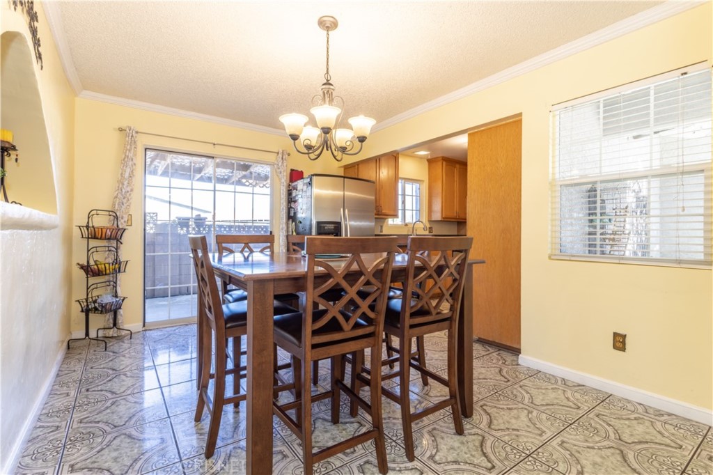 9021 Oneida Avenue Sun Valley, CA 91352 - Photo 10 of 36 a view of a dining room with furniture and chandelier