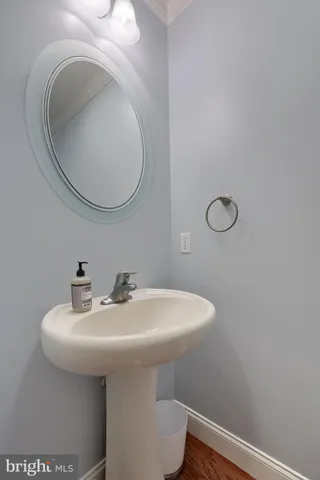 a kitchen with kitchen island wooden cabinets a sink and a stove