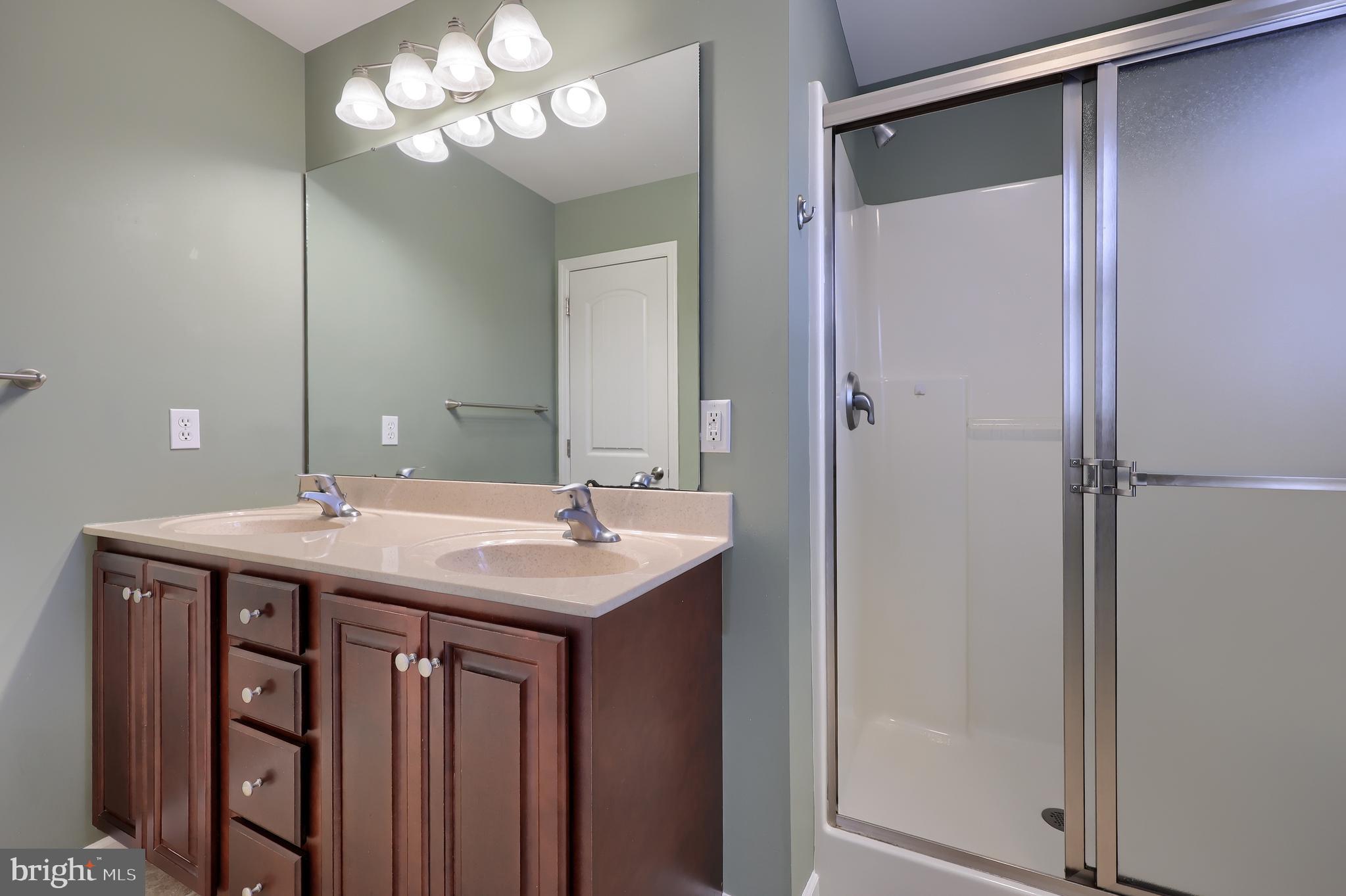 120 Baneberry Lane Lititz, PA 17543 - Photo 23 of 36 a bathroom with a sink and a mirror