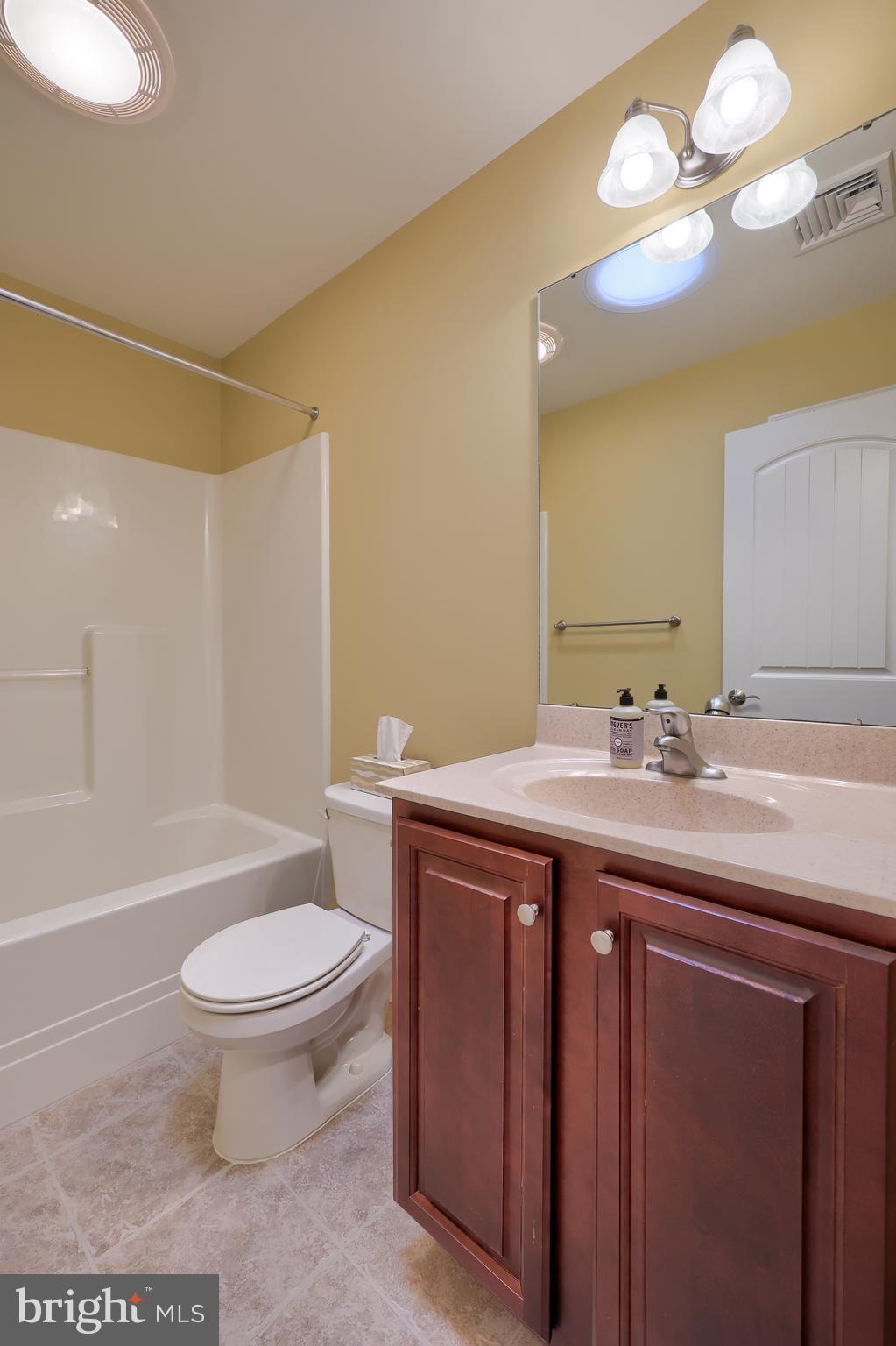 120 Baneberry Lane Lititz, PA 17543 - Photo 26 of 36 a spacious bathroom with a double vanity sink toilet and a mirror