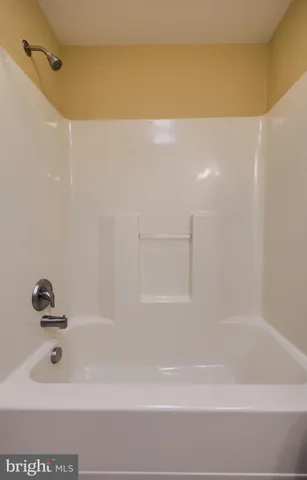 an empty room with a empty space and a window