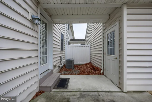 a view of a house with backyard and a garage