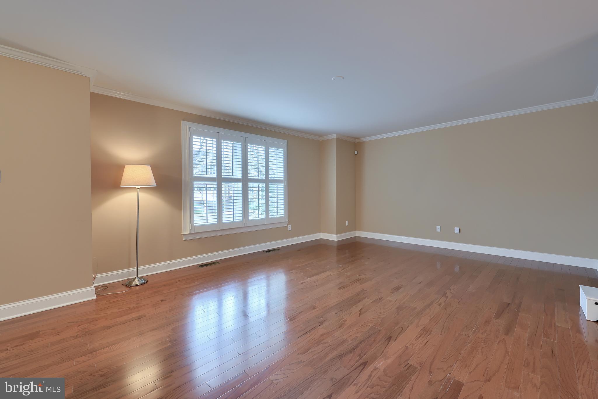 120 Baneberry Lane Lititz, PA 17543 - Photo 5 of 36 an empty room with wooden floor and windows