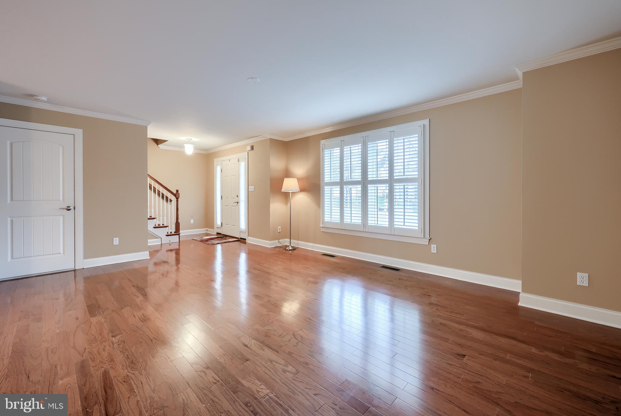 120 Baneberry Lane Lititz, PA 17543 - Photo 6 of 36 a view of an empty room with wooden floor and a window