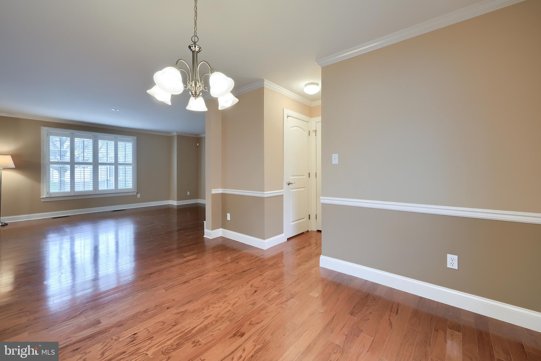 120 Baneberry Lane Lititz, PA 17543 - Photo 10 of 36 a view of an empty room with window and wooden floor