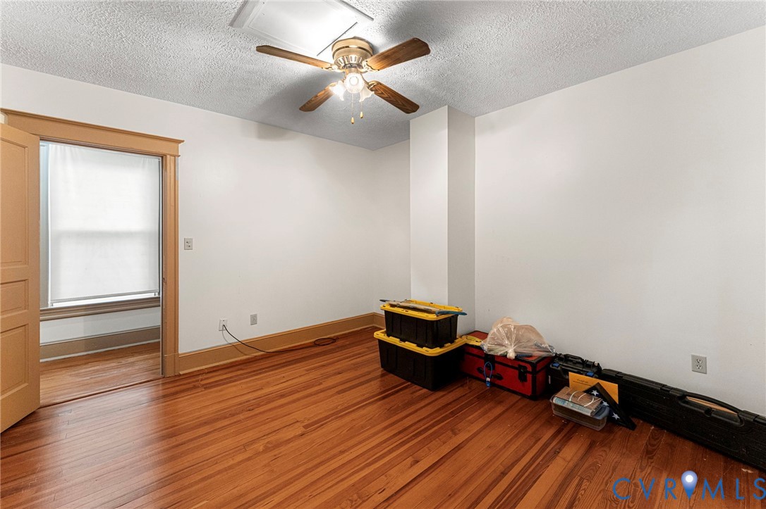 4516 Oldhams Road Hague, VA 22469 - Photo 16 of 23 a room with wooden floor and ceiling fan