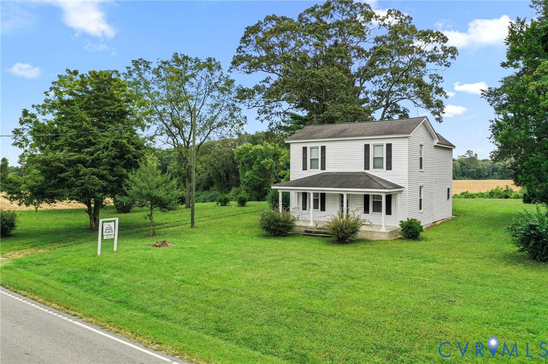 4516 Oldhams Road Hague, VA 22469 - Photo 2 of 23 a view of house with a big yard and large trees