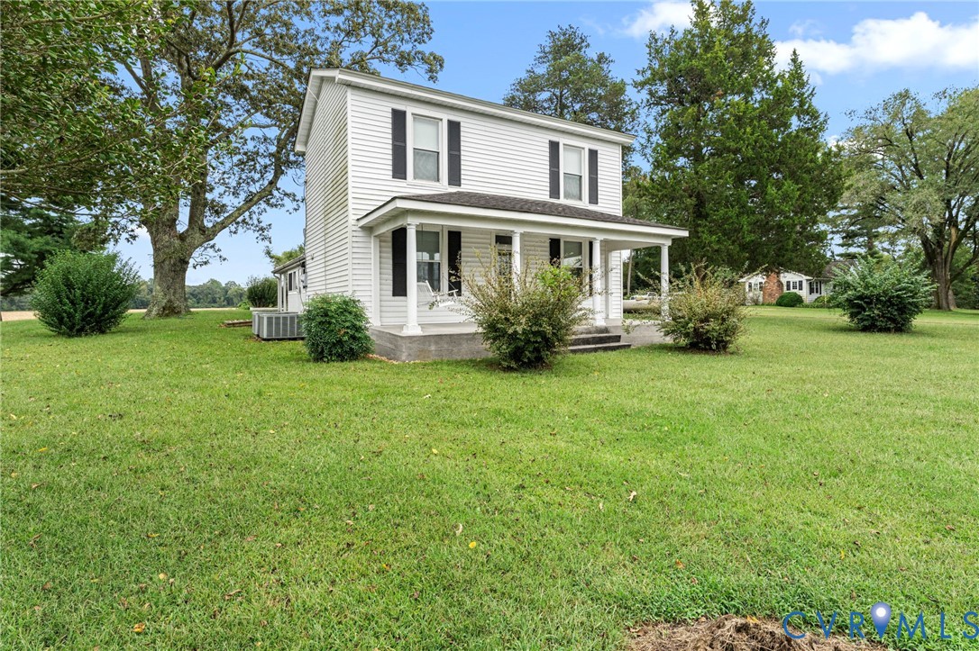 4516 Oldhams Road Hague, VA 22469 - Photo 22 of 23 a front view of a house with a yard and trees
