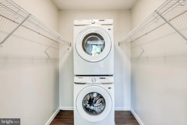 a view of a hallway with washer and dryer