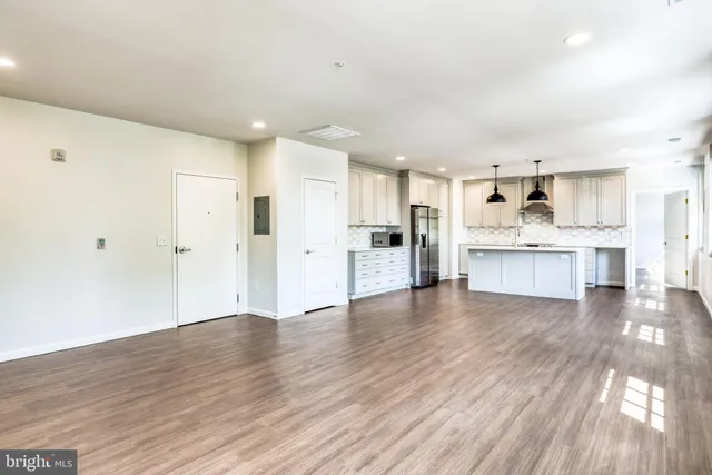 a view of kitchen with wooden floor
