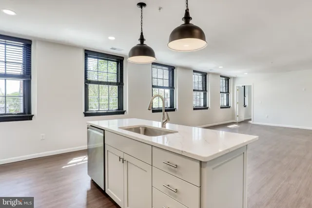 a kitchen with sink and window
