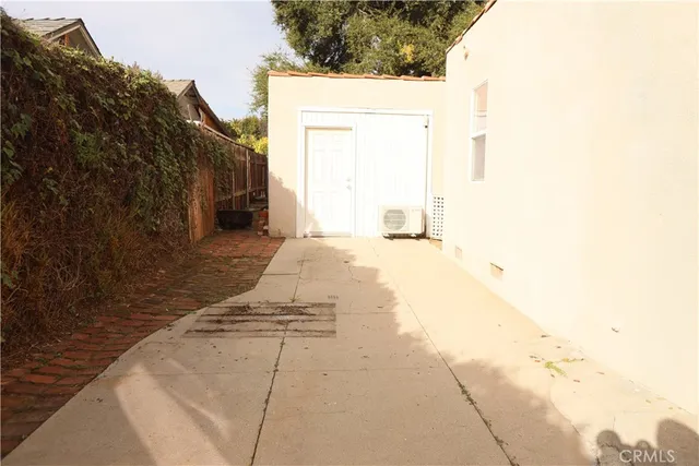 a view of backyard with large trees