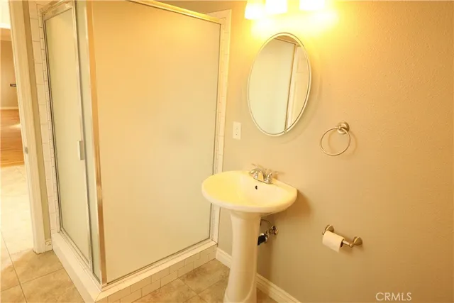 a bathroom with a sink mirror and toilet