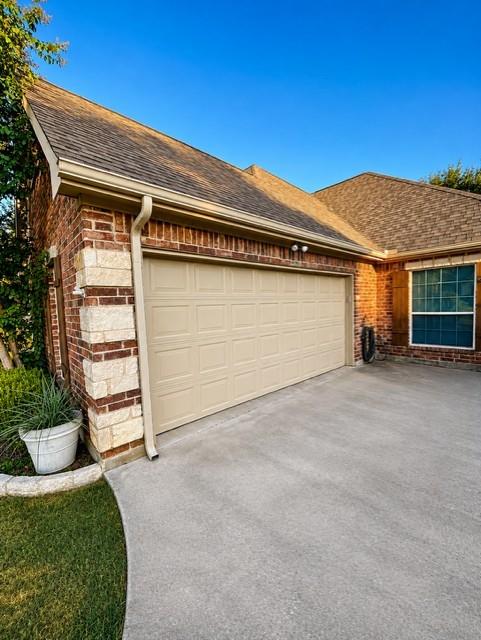 209 Cyndilu Lane Decatur, TX 76234 - Photo 26 of 26 Double garage with room for shelving and freezer