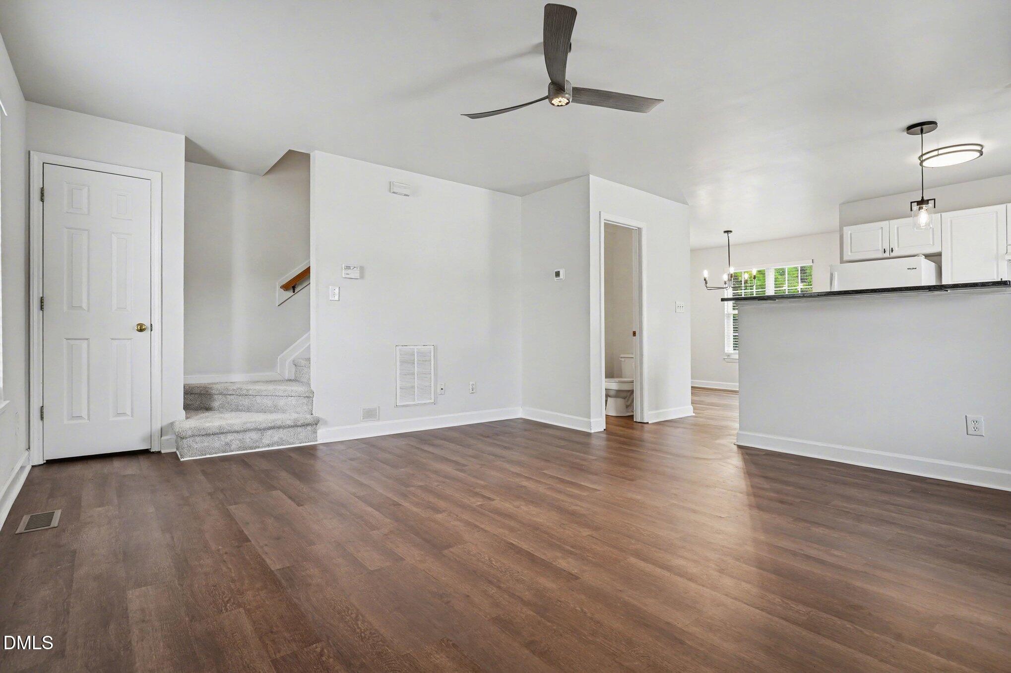 1237 Swingline Way Raleigh, NC 27610 - Photo 3 of 14 a view of empty room with wooden floor and window