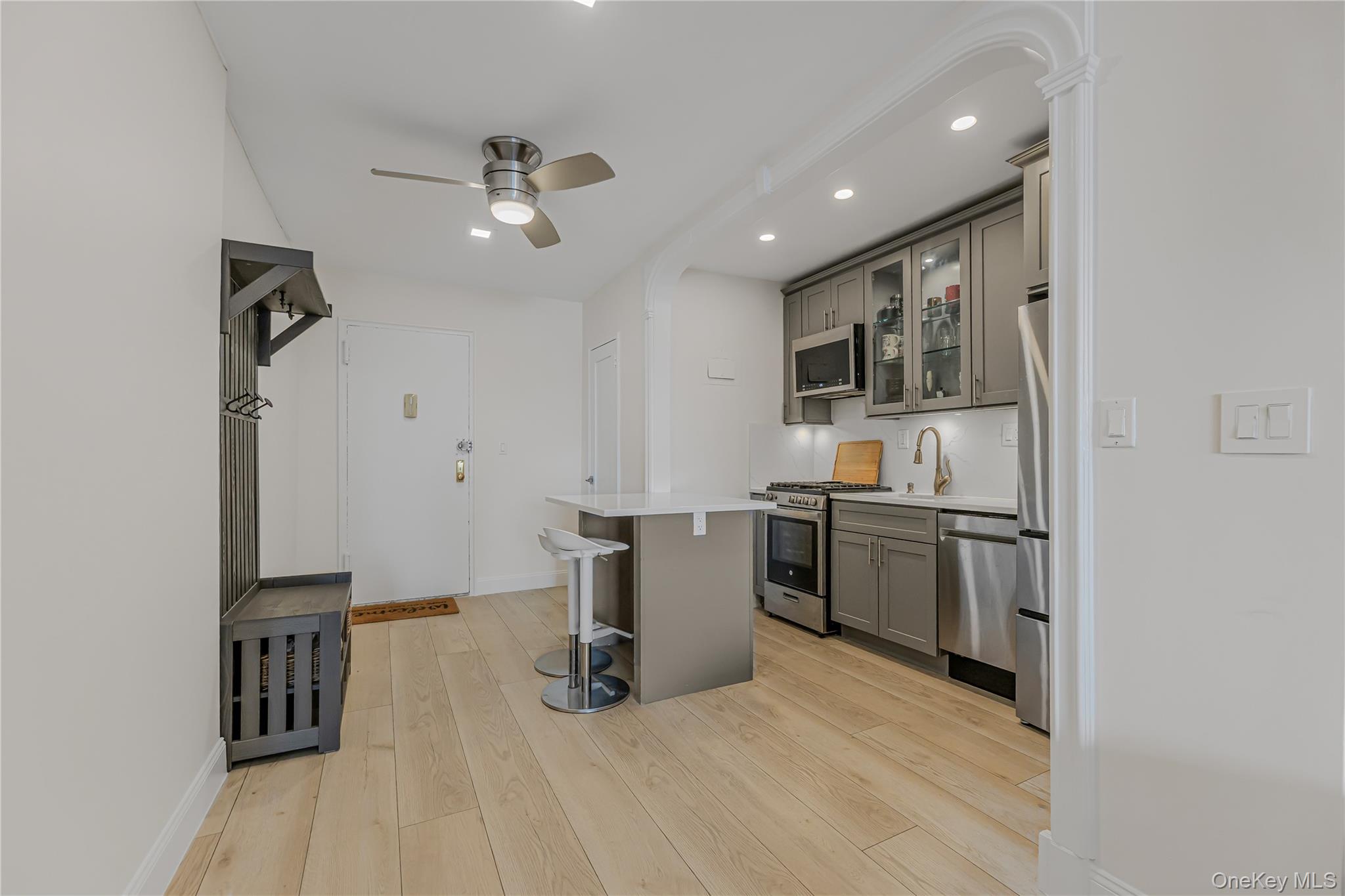 640 Pelham Road, Unit 3L New Rochelle, NY 10805 - Photo 5 of 20 a kitchen with a sink stainless steel appliances and cabinets