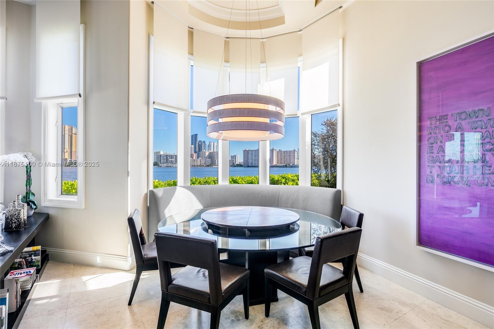 4042 Island Estates Drive Aventura, FL 33160 - Photo 13 of 46 a view of a dining room with furniture and chandelier