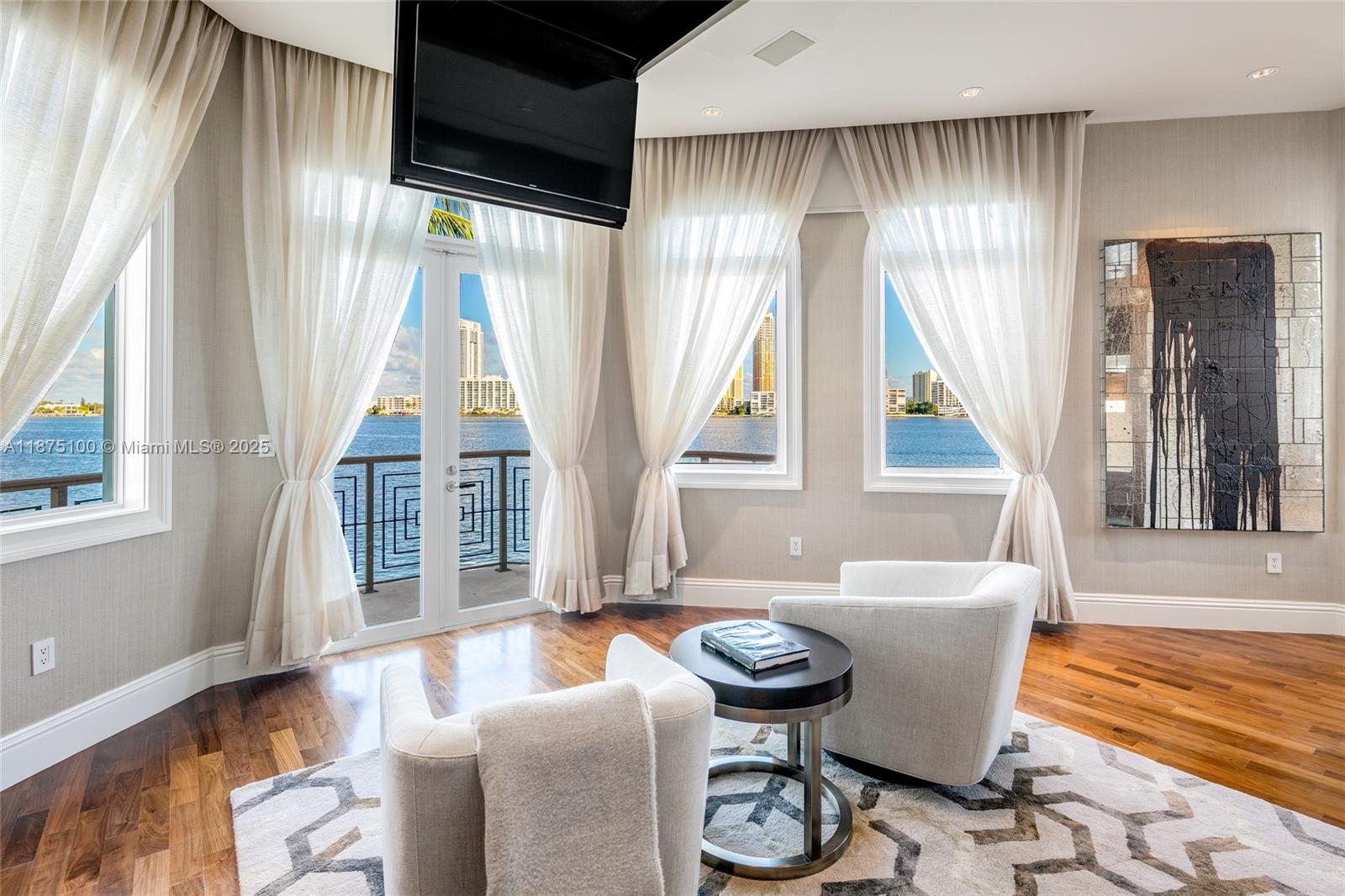 4042 Island Estates Drive Aventura, FL 33160 - Photo 18 of 46 a living room with furniture and a large window