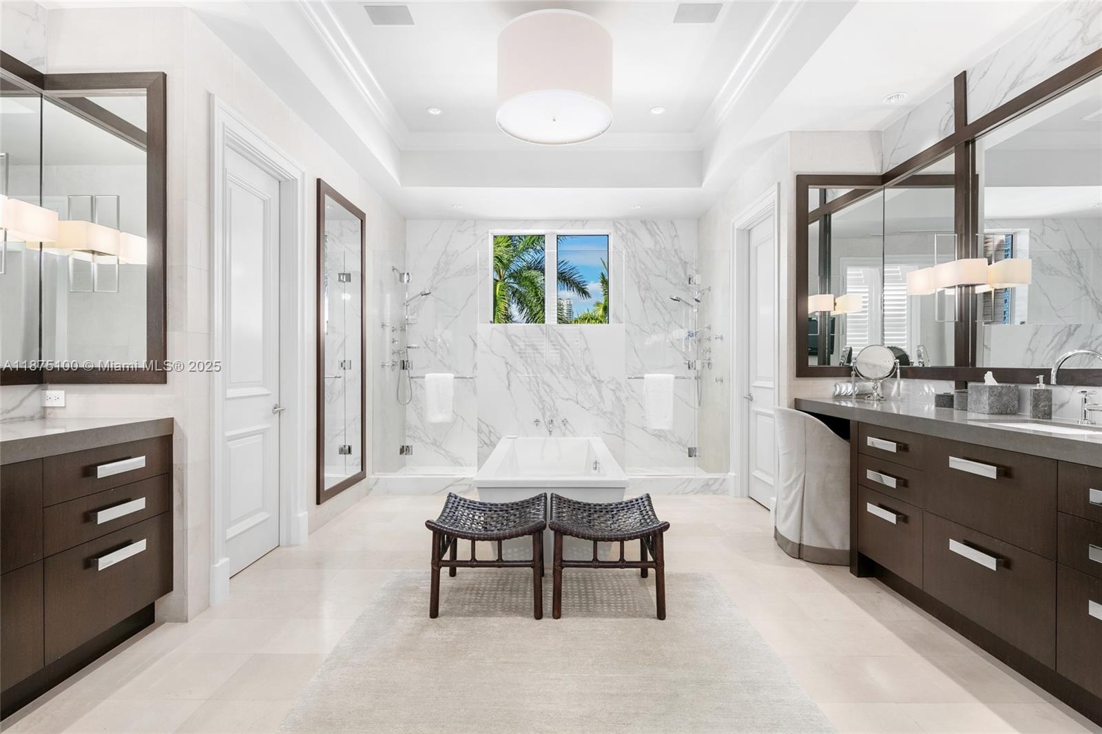 4042 Island Estates Drive Aventura, FL 33160 - Photo 19 of 46 a spacious bathroom with a double vanity sink a mirror and a shower